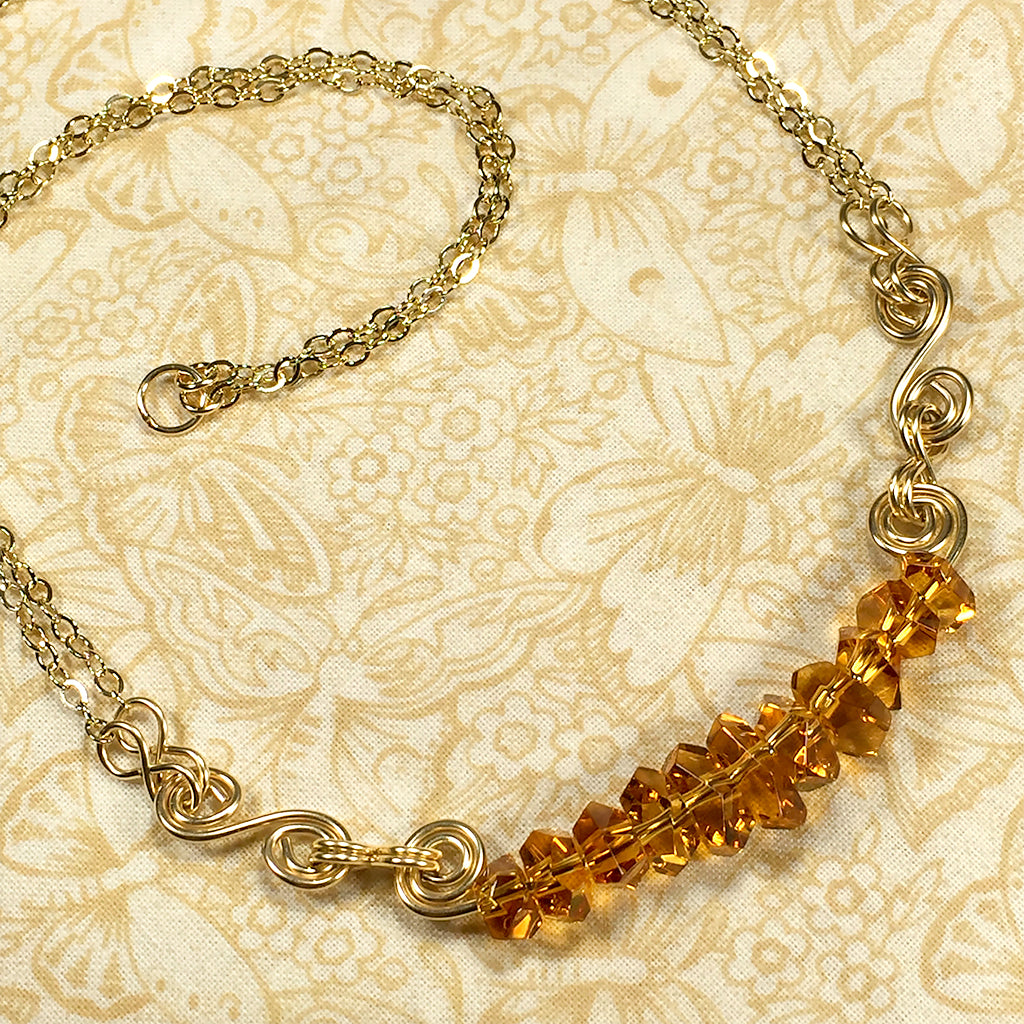 Gold-filled spiral necklace with faceted citrine nugget beads