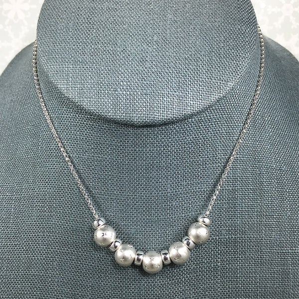 Sterling silver necklace with 12-star pattern beads