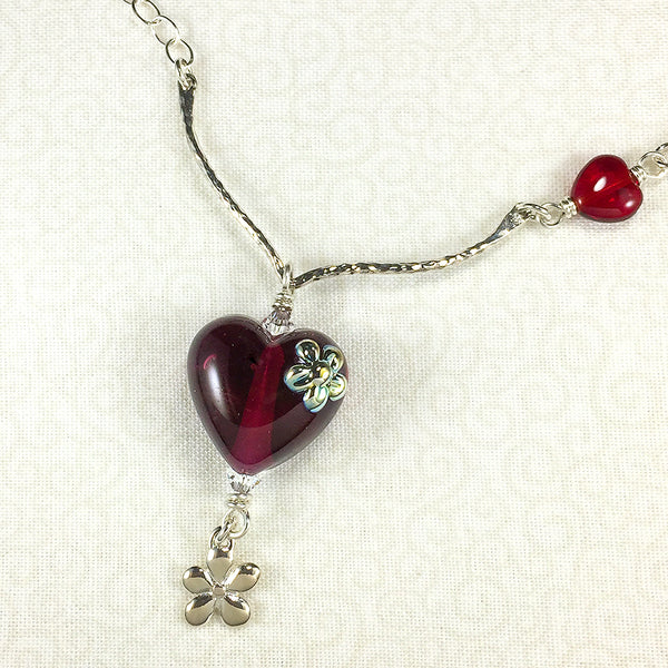 Sterling necklace with wine-red art glass heart bead and silver flowers