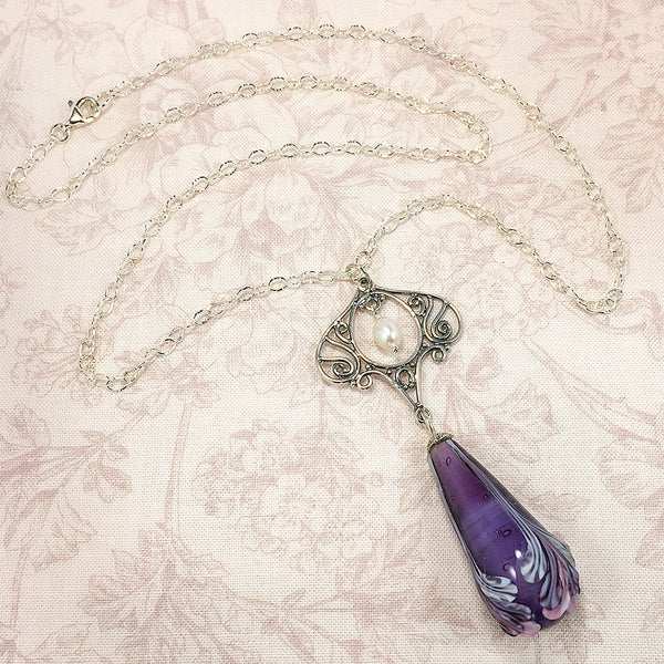 Sterling Art Nouveau style necklace with purple floral art glass bead and white freshwater pearl